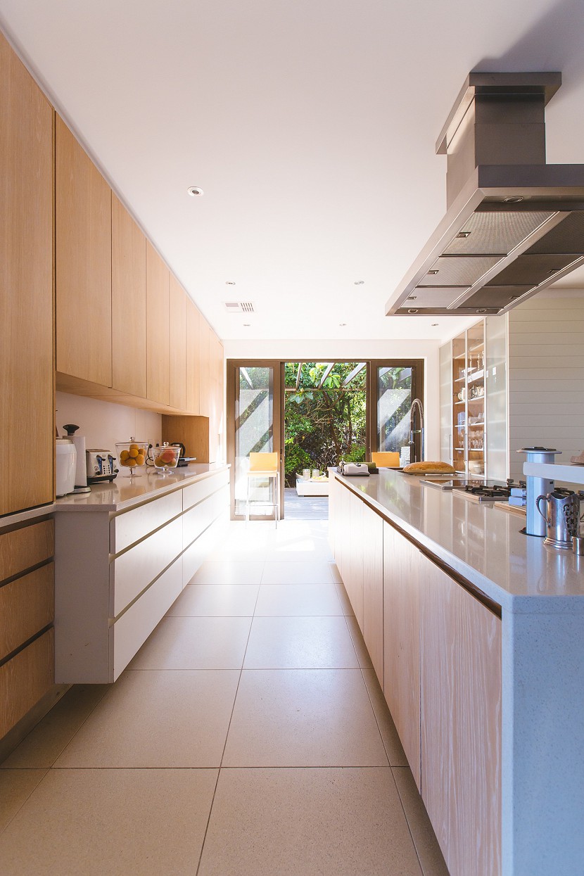 Modern kitchen looking out to a garden.
