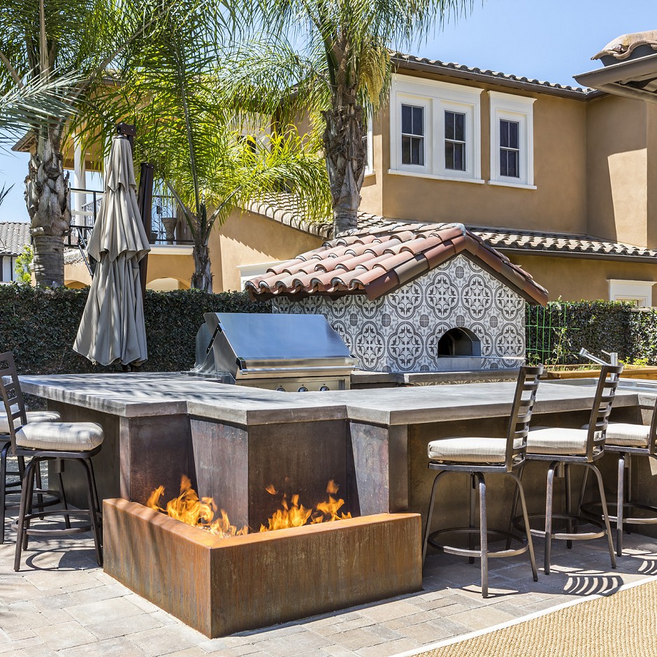 Outdoor eating area and pizza oven designed to exacting dimensions.